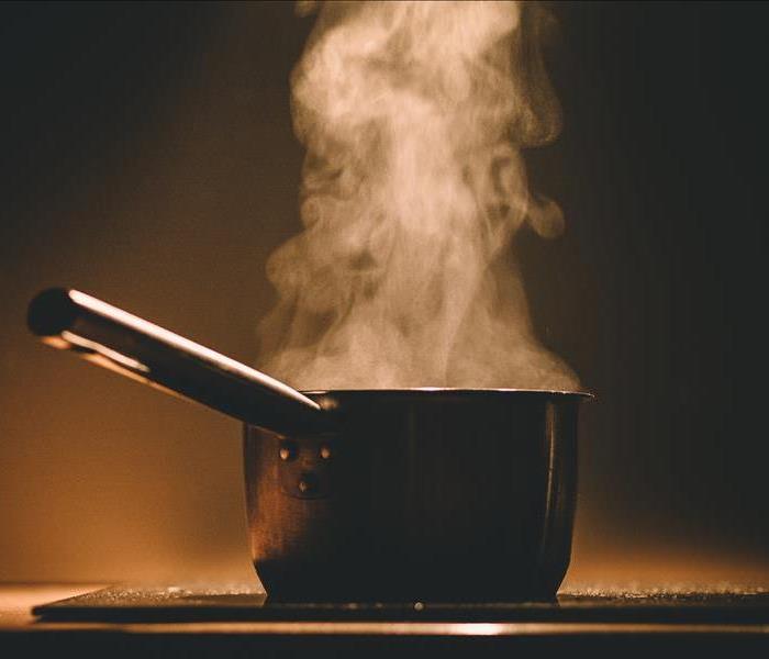 photo of pot cooking on the stove